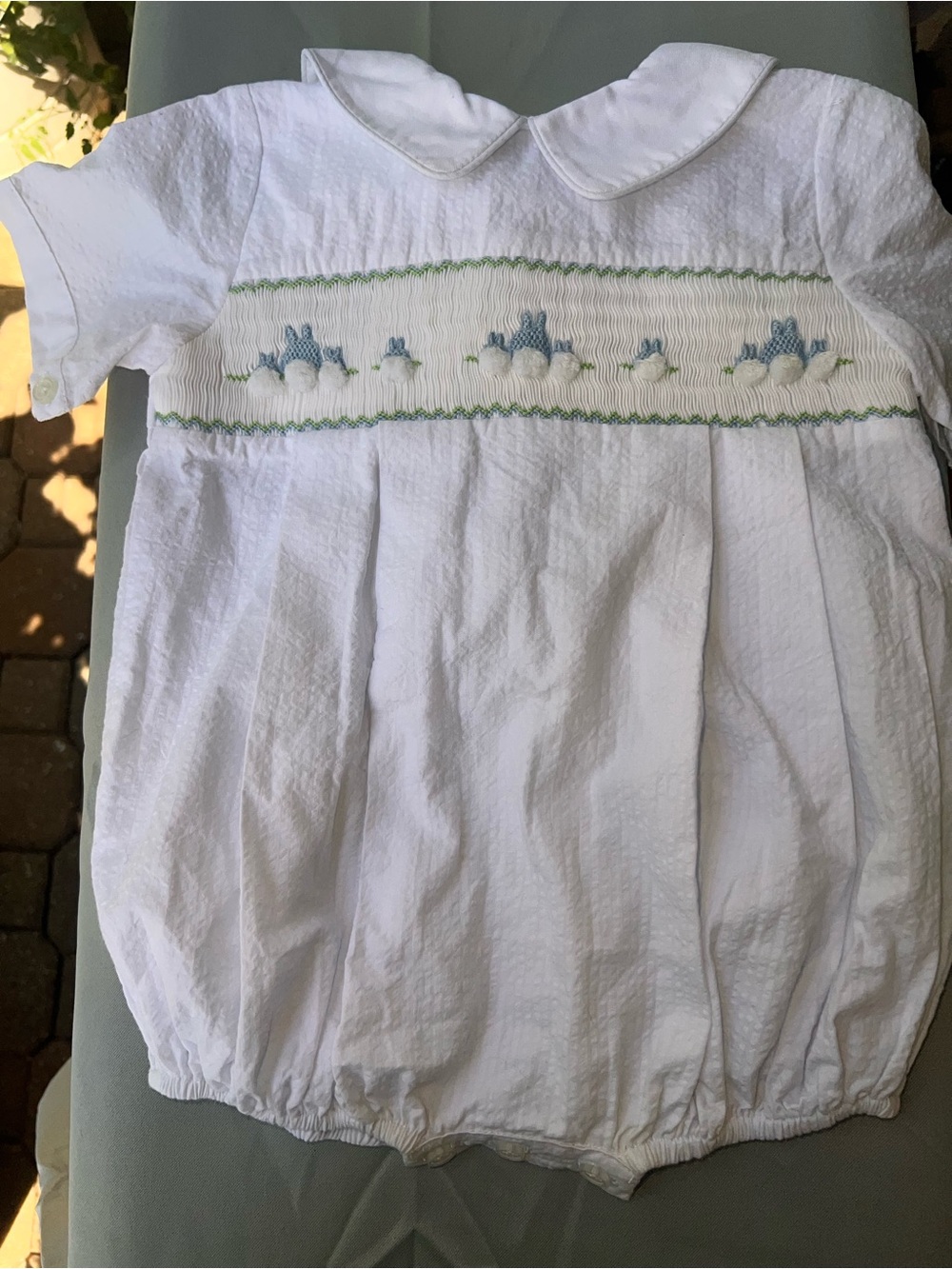 White Smocked Baby Bubble Romper with Blue Bunny Accent